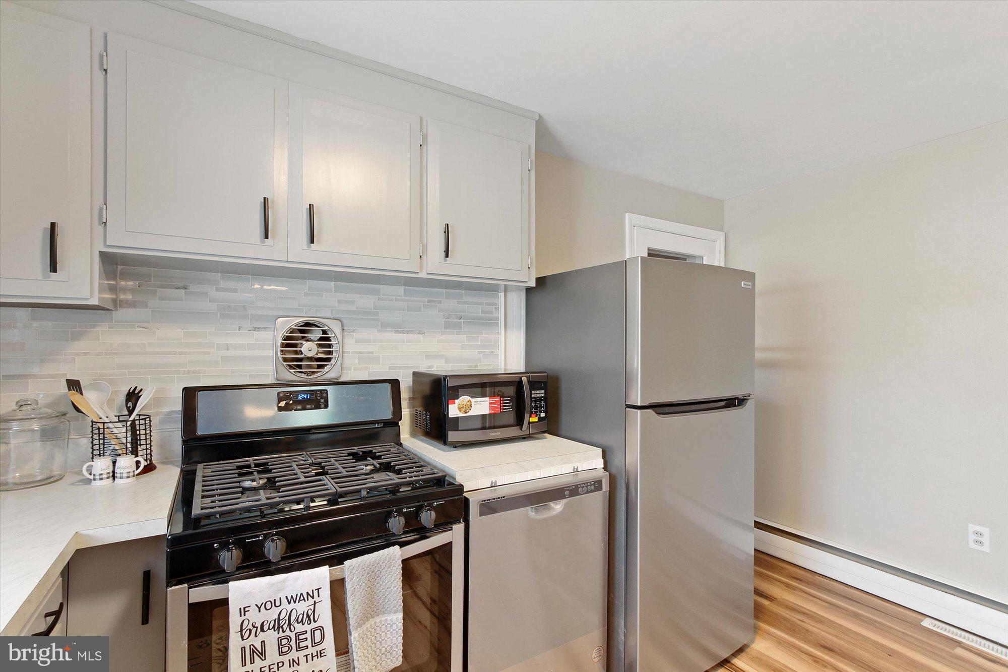 222 Dew Drop Road York, PA 17402 - Photo 10 of 31 a kitchen with a stove and a refrigerator