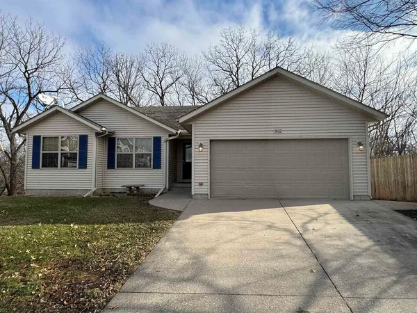 a house with trees in the background