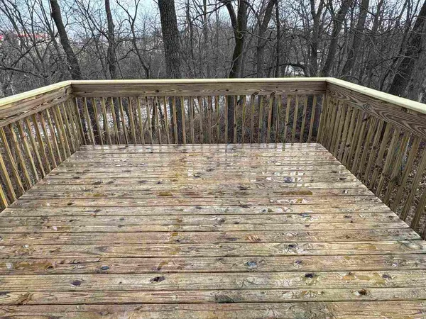 a view of balcony with wooden floor