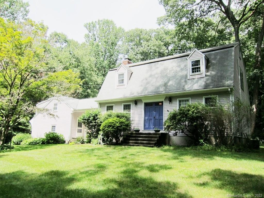 a view of a house with garden and yard