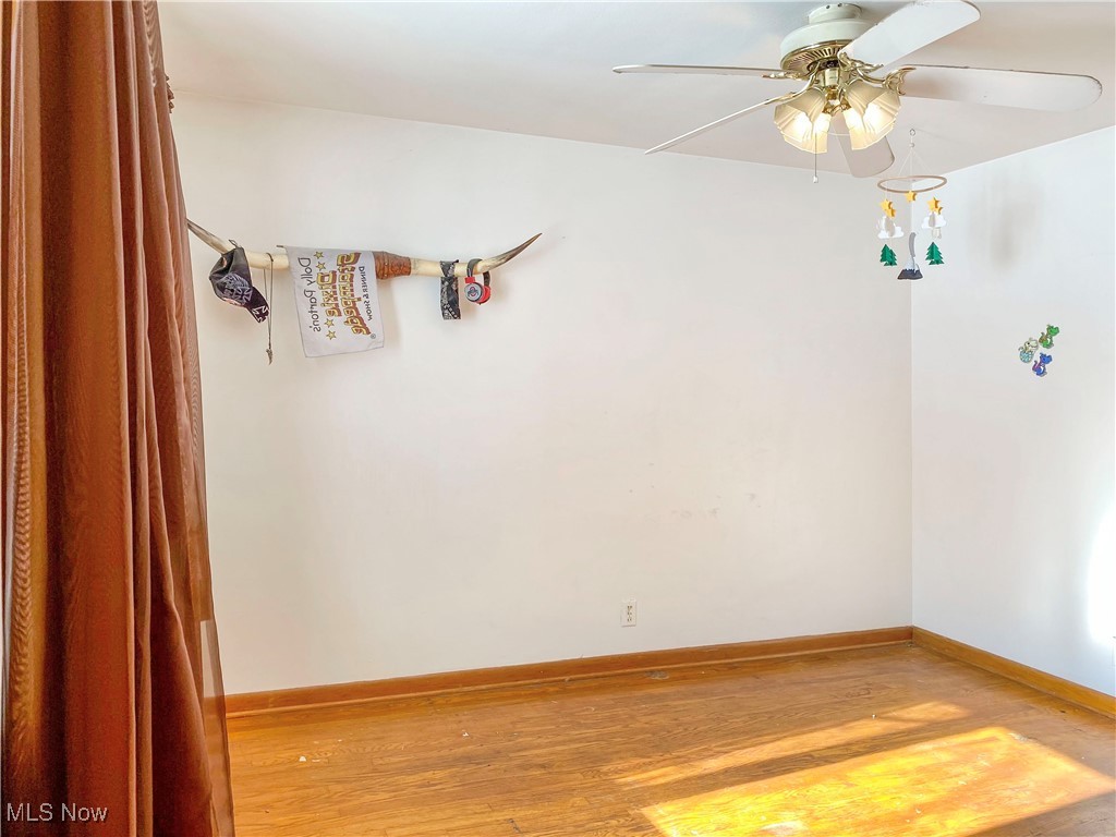 1034 Straub Road West Mansfield, OH 44904 - Photo 10 of 27 Spare room with ceiling fan and light wood-type flooring