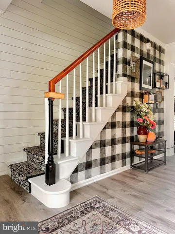 a view of staircase with white walls