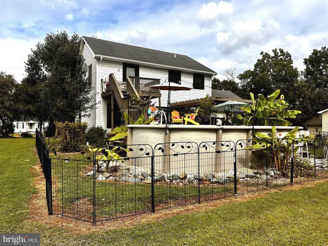a swimming pool view with a outdoor seating