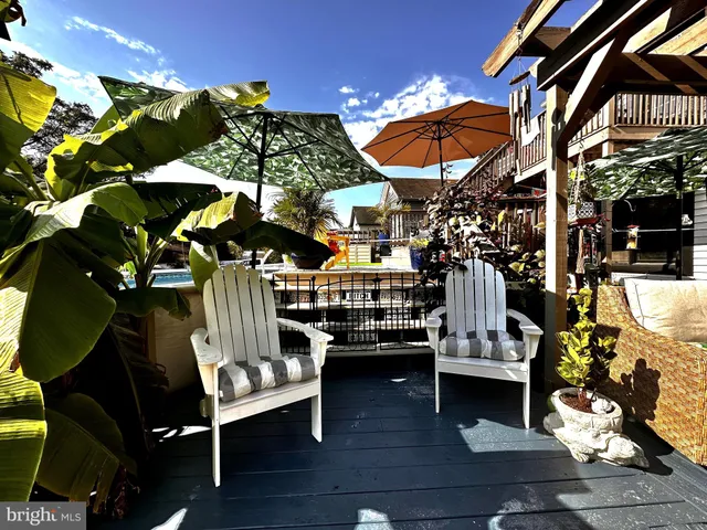 a view of a chairs and table in a patio