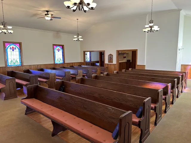 a living room with lots of furniture and a chandelier