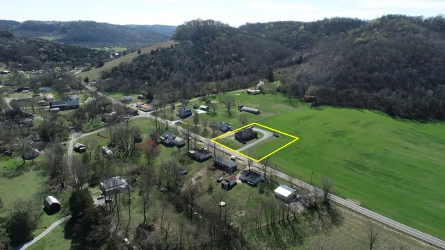 a view of a tennis ground with a mountain