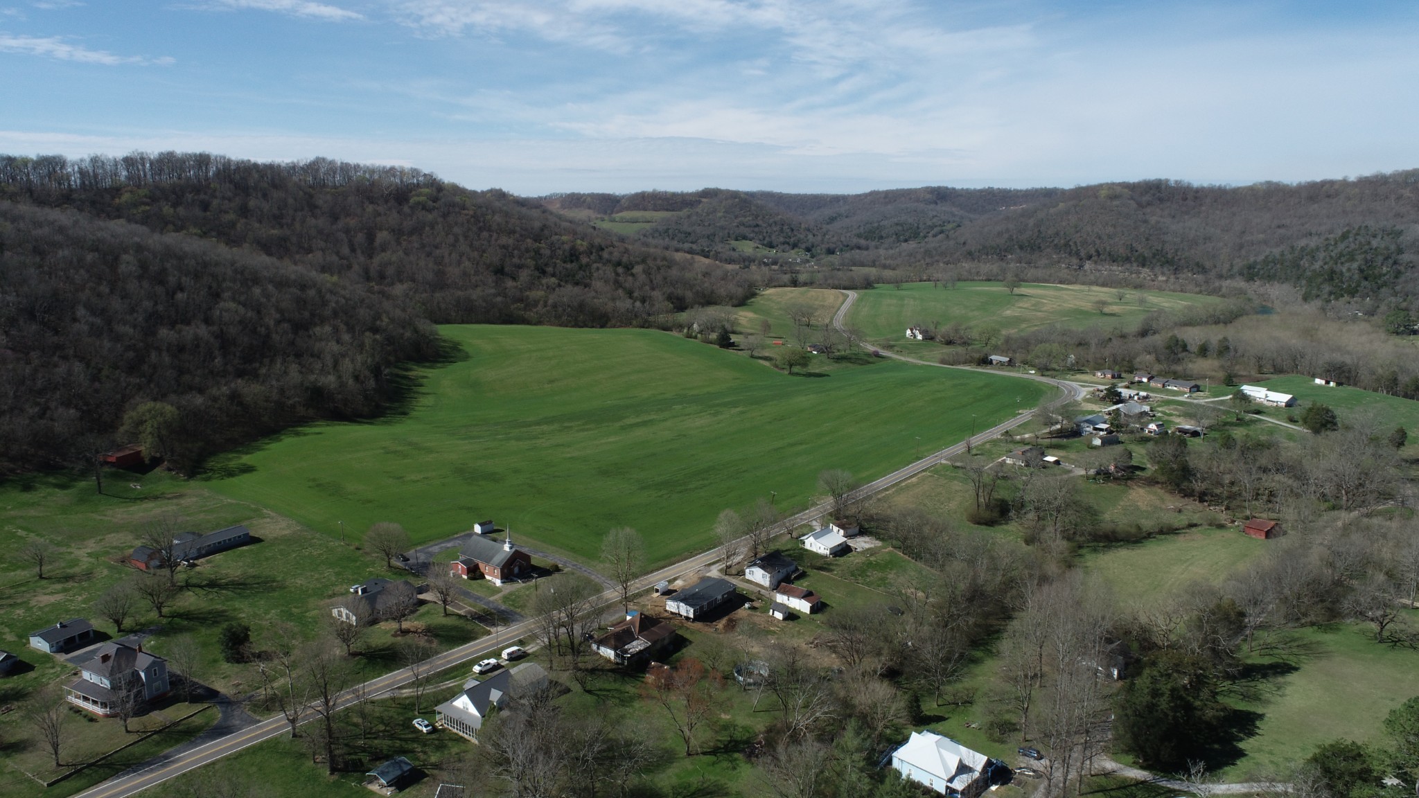 732 Lancaster Highway Lancaster, TN 38569 - Photo 5 of 36 a view of a lush green hillside and houses