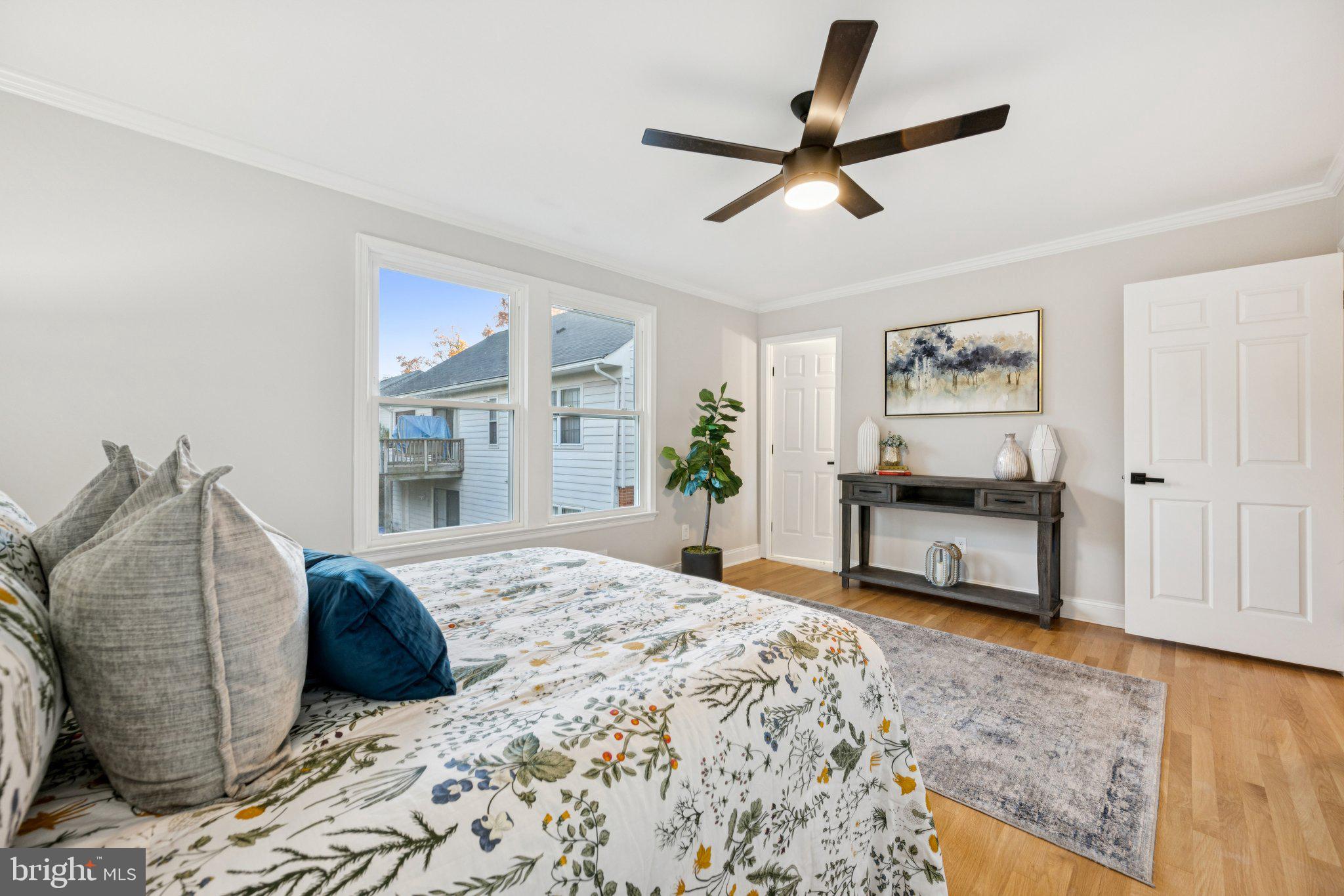 5144 Westpath Way Bethesda, MD 20816 - Photo 16 of 42 a living room with a bed furniture and a window