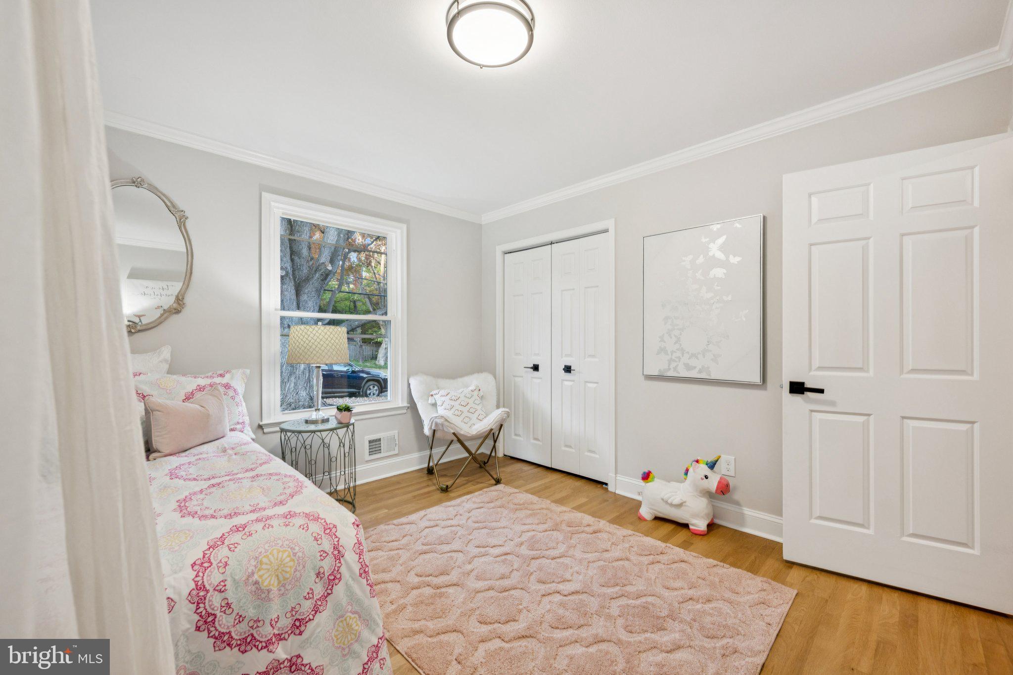 5144 Westpath Way Bethesda, MD 20816 - Photo 20 of 42 a bedroom with furniture and wooden floor
