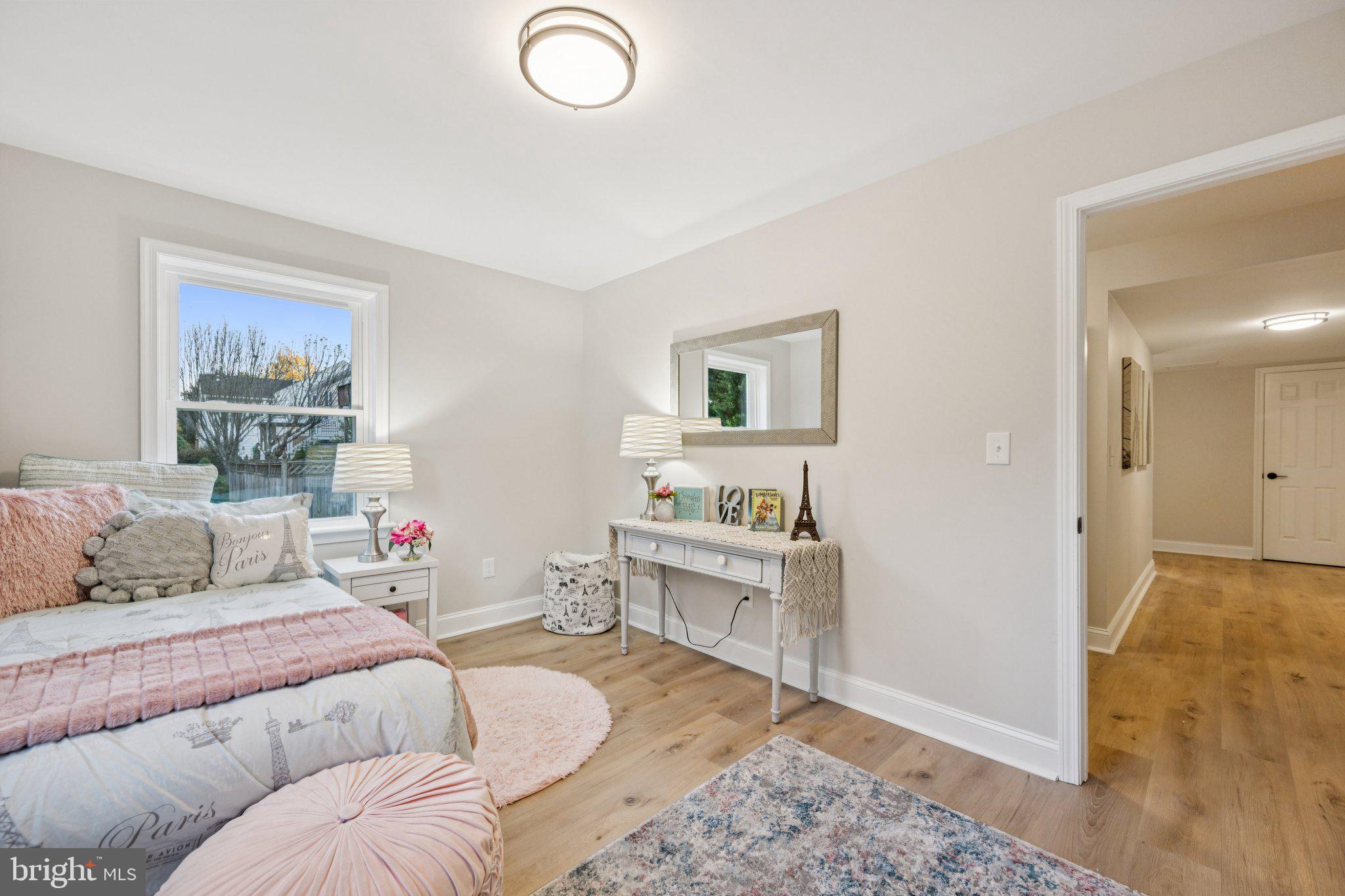 5144 Westpath Way Bethesda, MD 20816 - Photo 24 of 42 a bedroom with a bed and a couch