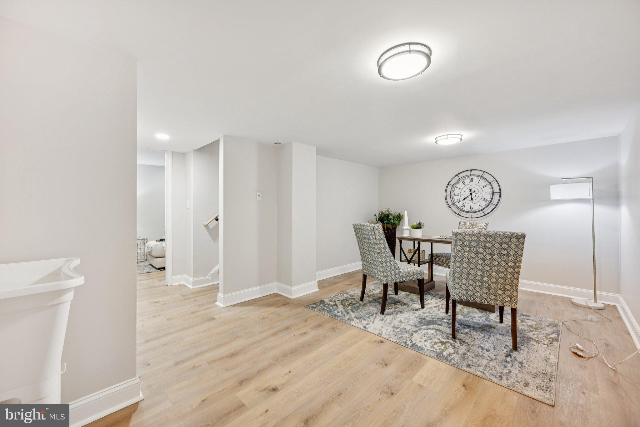 5144 Westpath Way Bethesda, MD 20816 - Photo 34 of 42 a view of a livingroom with furniture and wooden floor