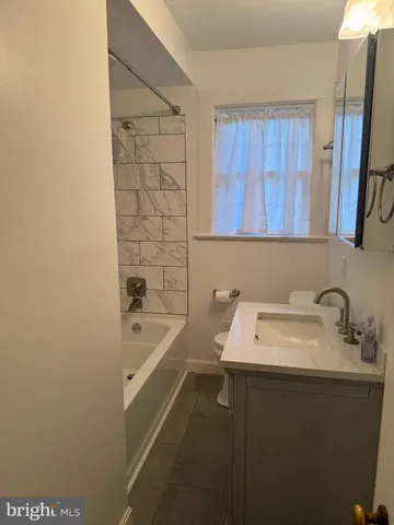 a bathroom with a sink and a bathtub
