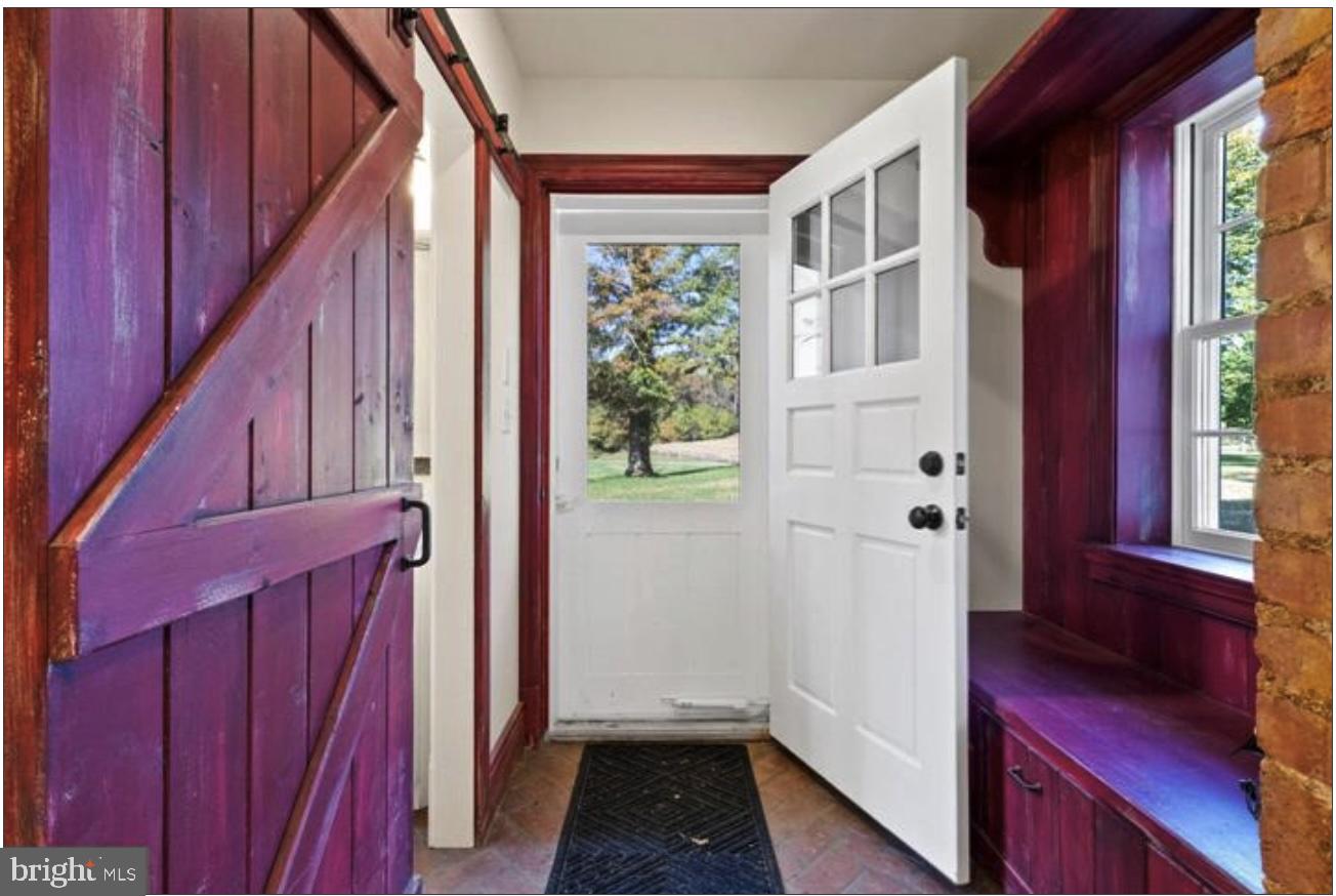 16131 Old York Road Monkton, MD 21111 - Photo 17 of 31 a view of a hallway with front door wooden floor and staircase
