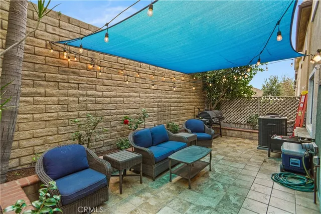 a view of a chairs and table in backyard