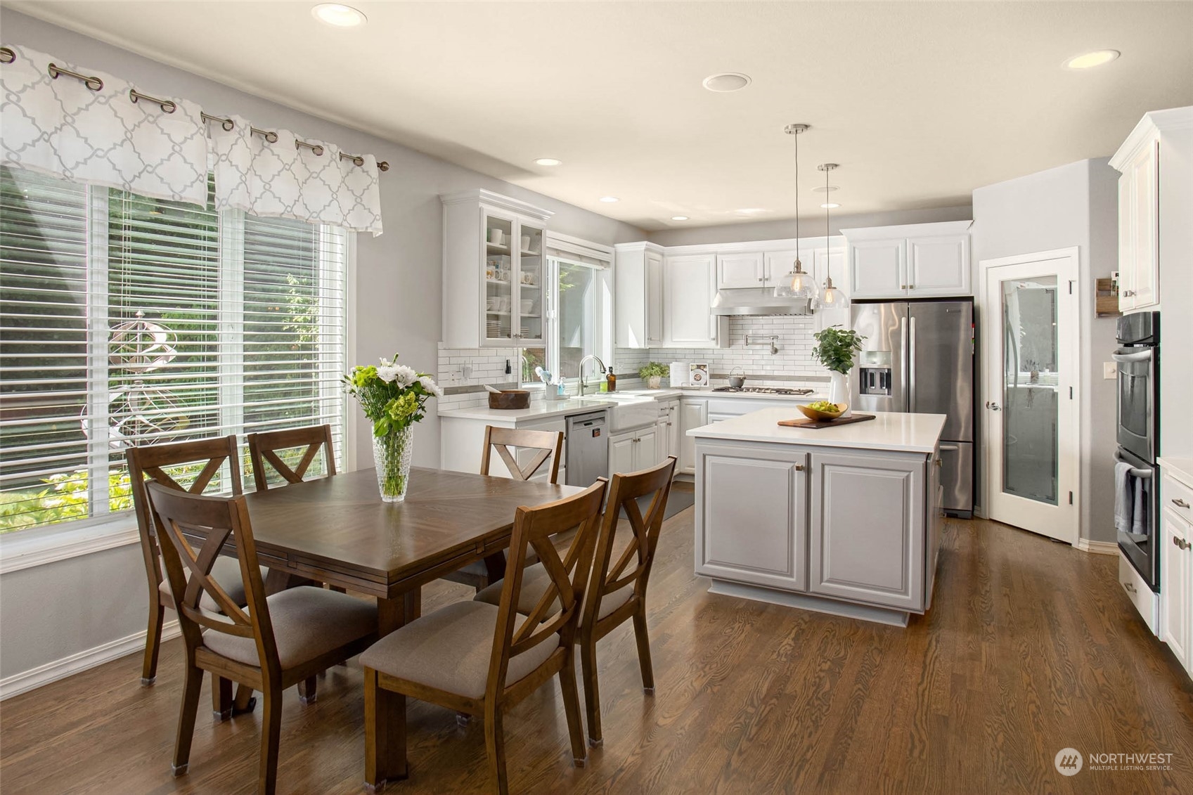 3608 214th Place Southeast Bothell, WA 98021 - Photo 16 of 37 a kitchen with a table chairs and refrigerator