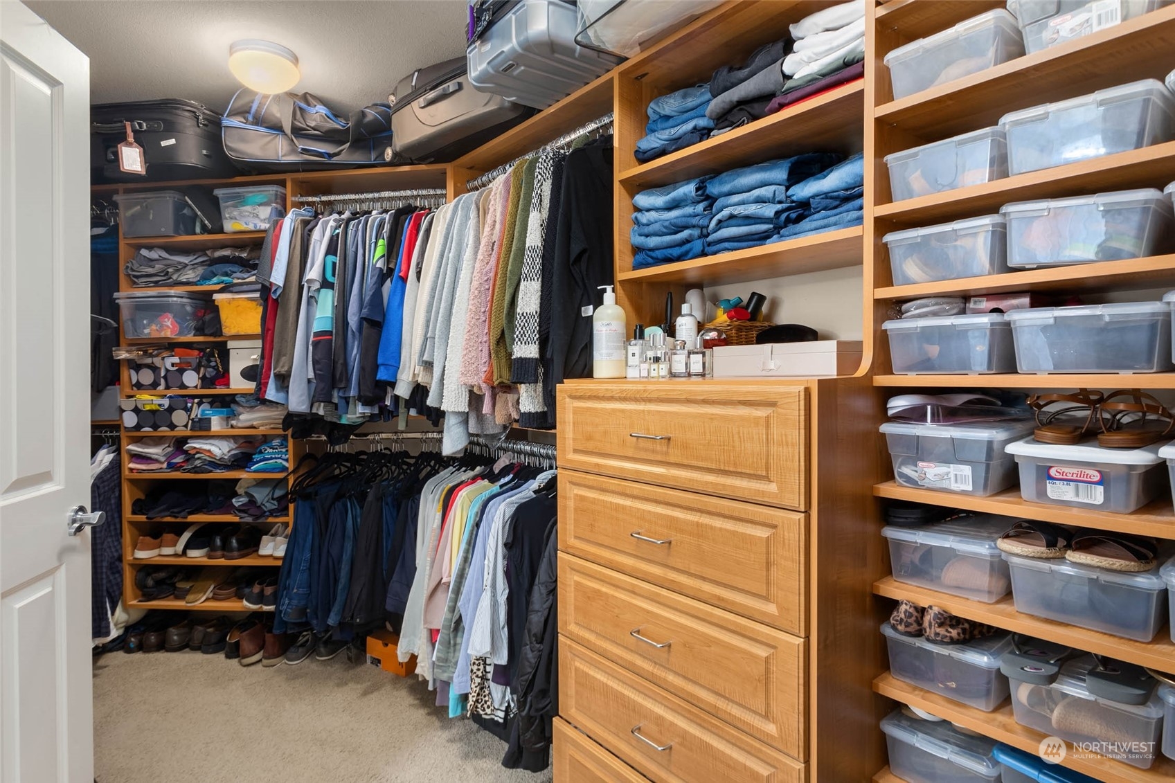 3608 214th Place Southeast Bothell, WA 98021 - Photo 28 of 37 a view of walk in closet with clothes and shoes