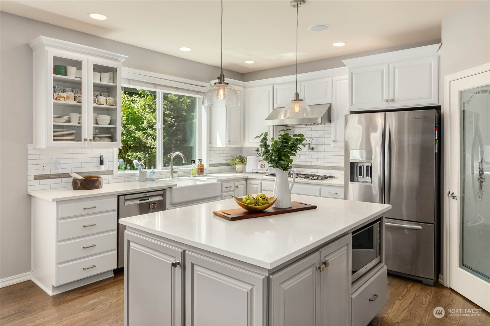 3608 214th Place Southeast Bothell, WA 98021 - Photo 5 of 37 a kitchen with a refrigerator a sink and cabinets