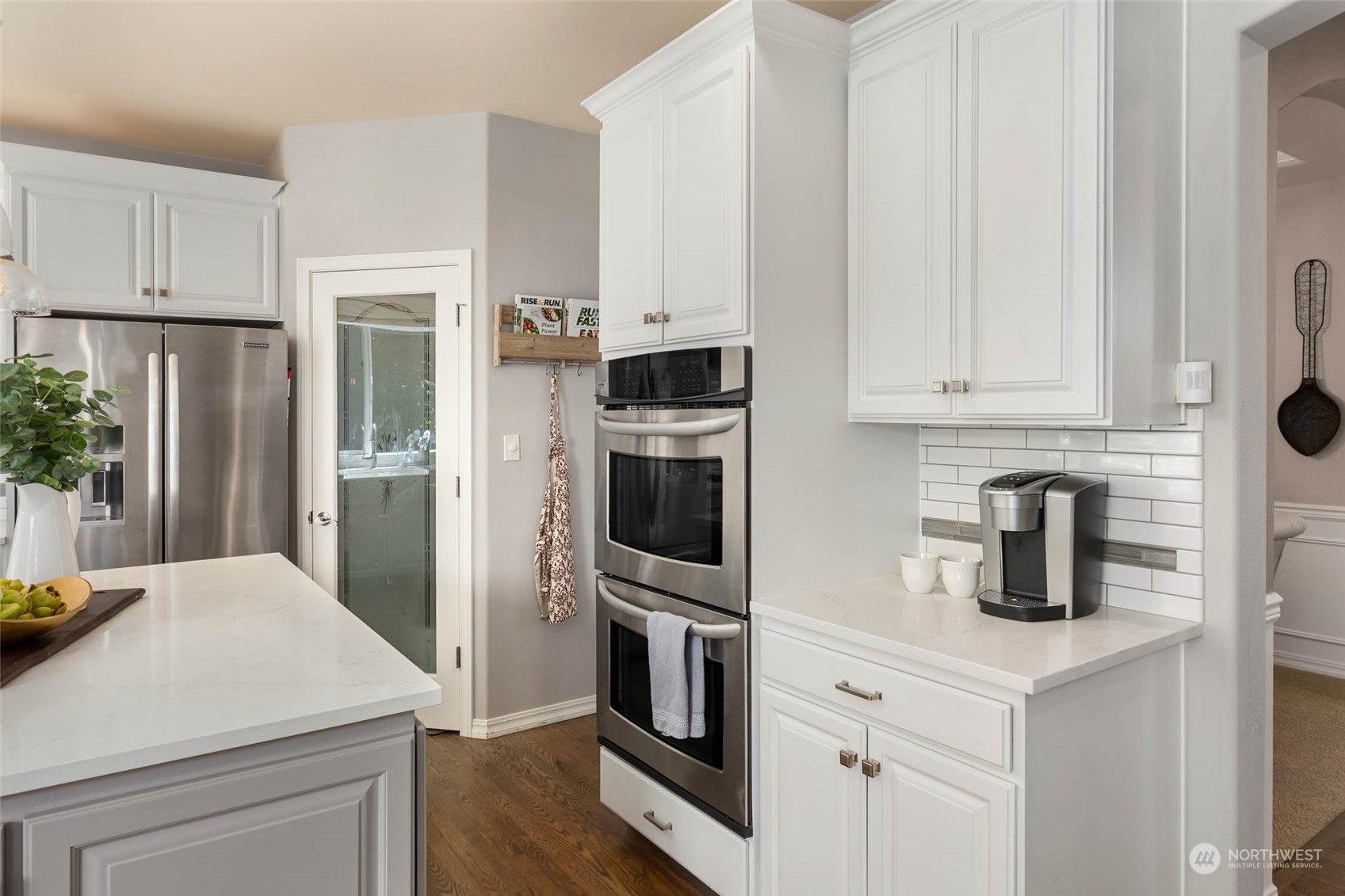 3608 214th Place Southeast Bothell, WA 98021 - Photo 6 of 37 a kitchen with white cabinets and stainless steel appliances