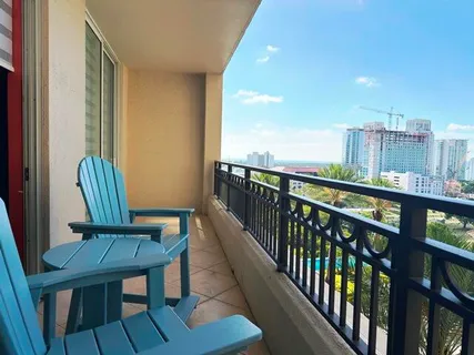 a view of a chair and table in the balcony