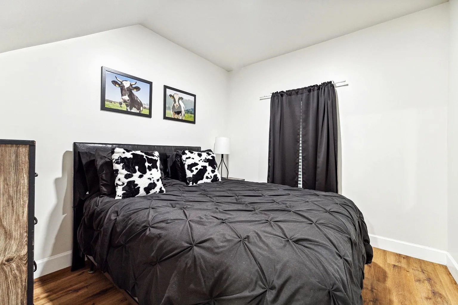 2304 Chapman Street, Unit 3 Houston, TX 77009 - Photo 9 of 17 a bedroom with a bed and wooden floor