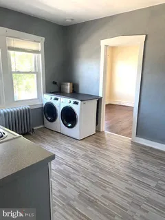 a view of kitchen and wooden floor