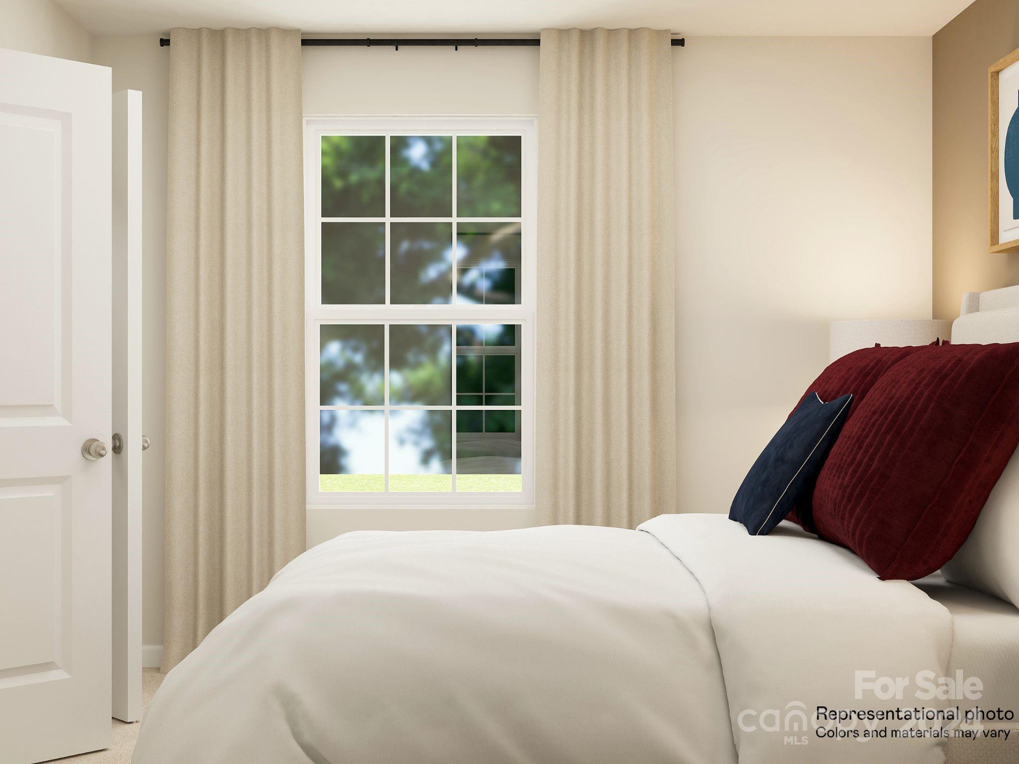641 Mile Crk Road, Unit 72 Edgemoor, SC 29712 - Photo 4 of 16 a bedroom with a bed and a window
