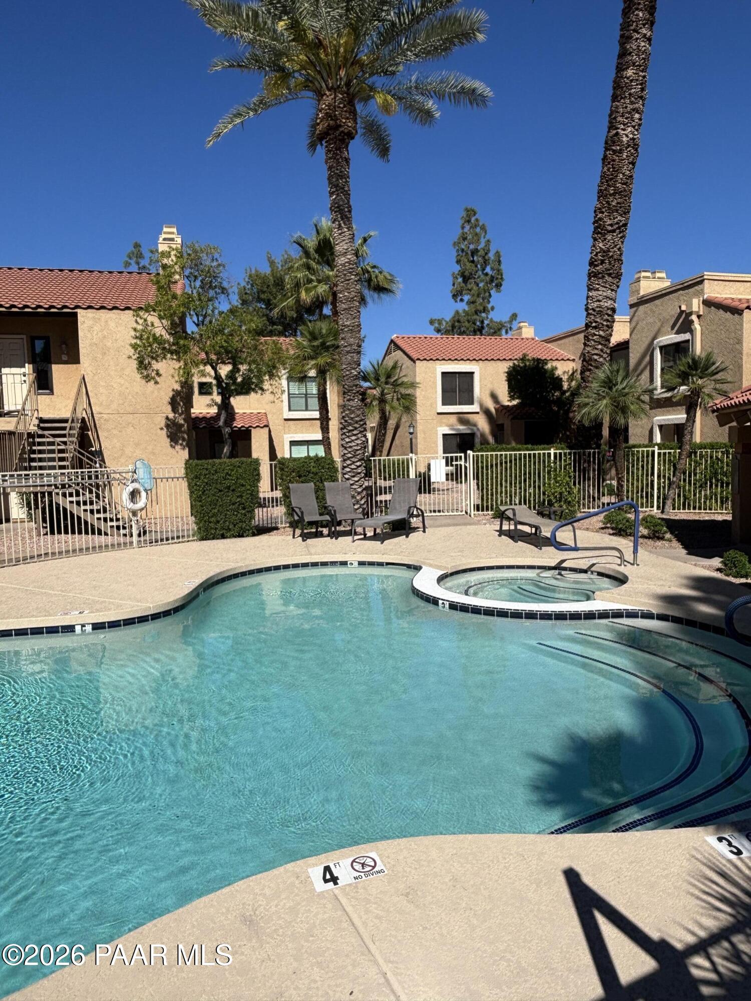 8787 East Mountain View Road, Unit 1082 Scottsdale, AZ 85258 - Photo 1 of 46 a view of a house with a yard