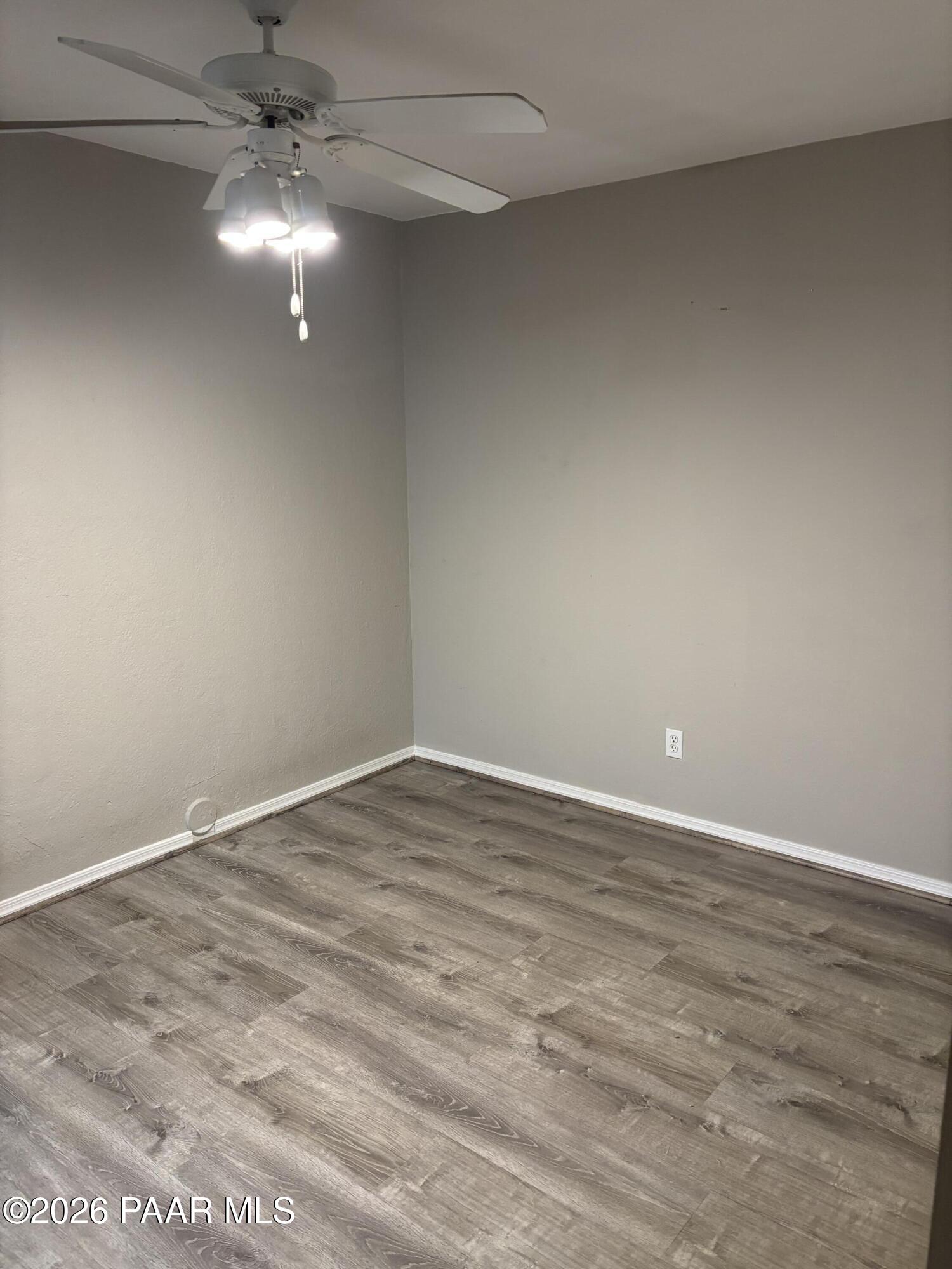 8787 East Mountain View Road, Unit 1082 Scottsdale, AZ 85258 - Photo 20 of 46 an empty room with a fan & a window