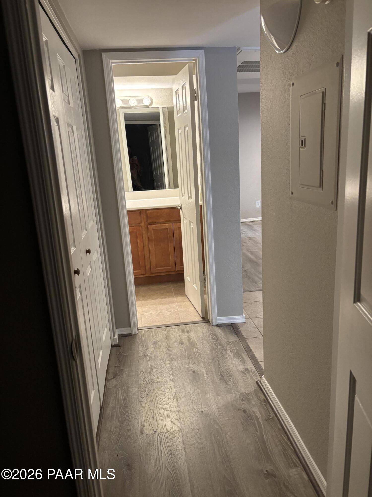 8787 East Mountain View Road, Unit 1082 Scottsdale, AZ 85258 - Photo 27 of 46 a view of a hallway with wooden floor