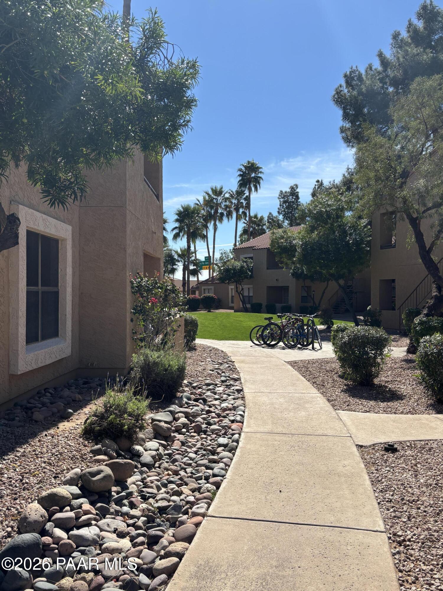 8787 East Mountain View Road, Unit 1082 Scottsdale, AZ 85258 - Photo 30 of 46 a view of a backyard with sitting area
