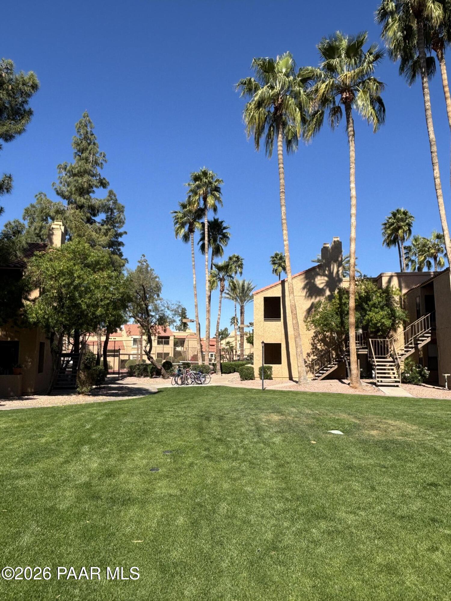 8787 East Mountain View Road, Unit 1082 Scottsdale, AZ 85258 - Photo 41 of 46 a view of a house with yard