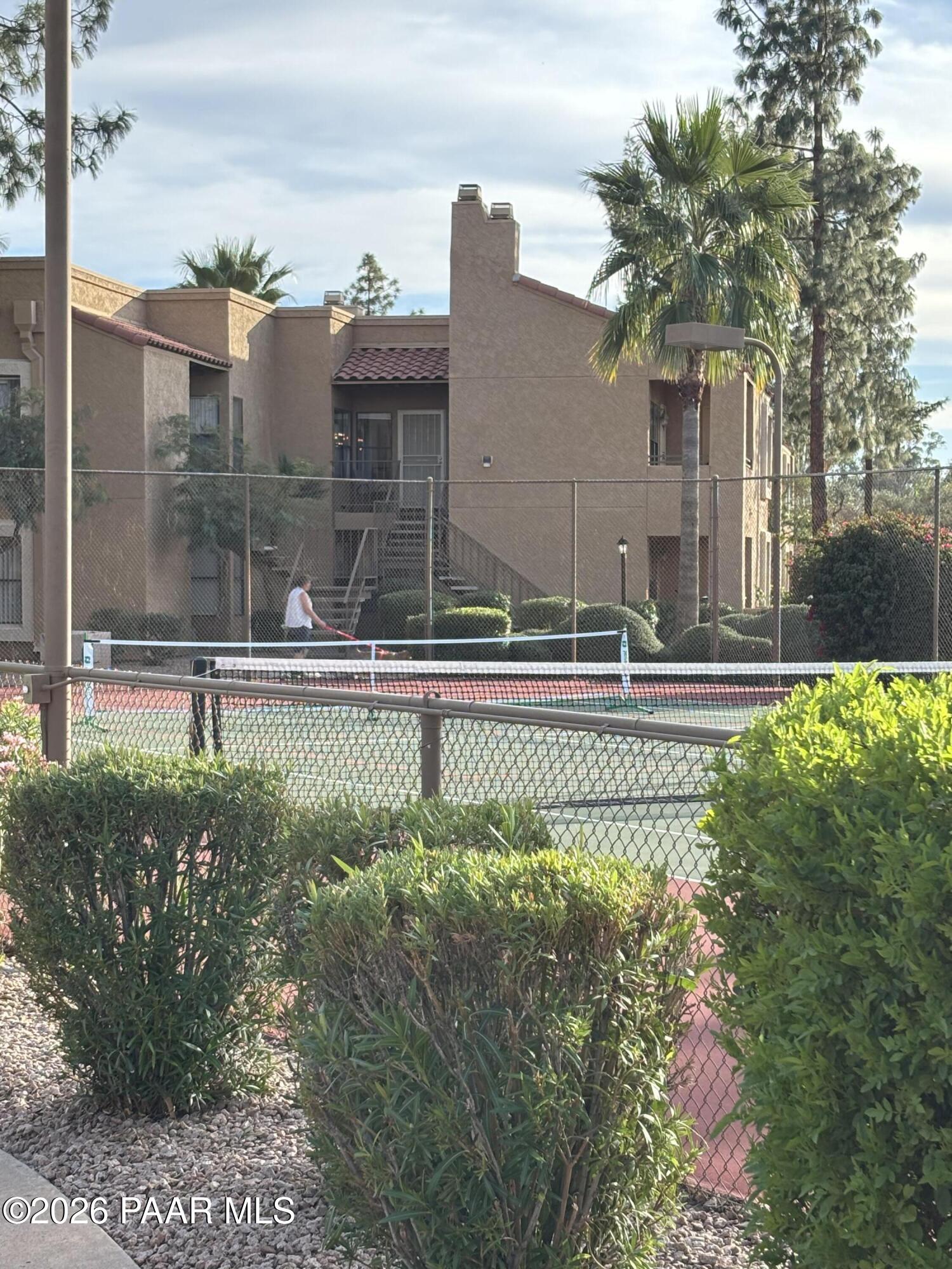 8787 East Mountain View Road, Unit 1082 Scottsdale, AZ 85258 - Photo 44 of 46 a view of a house with a yard