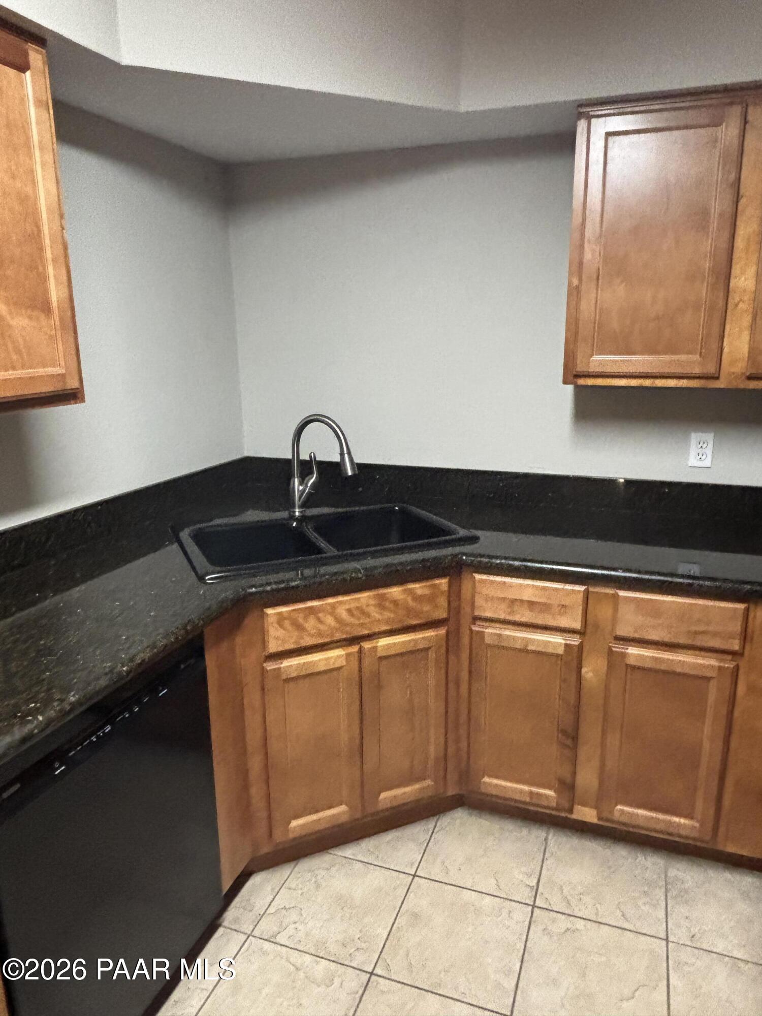 8787 East Mountain View Road, Unit 1082 Scottsdale, AZ 85258 - Photo 9 of 46 a kitchen with granite countertop a sink and a stove