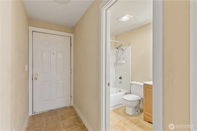 a bathroom with a toilet sink and a shower