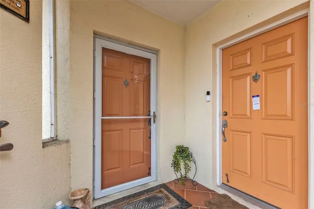 a view of front door with wooden floor