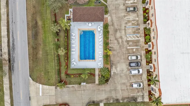an aerial view of residential houses with swimming pool