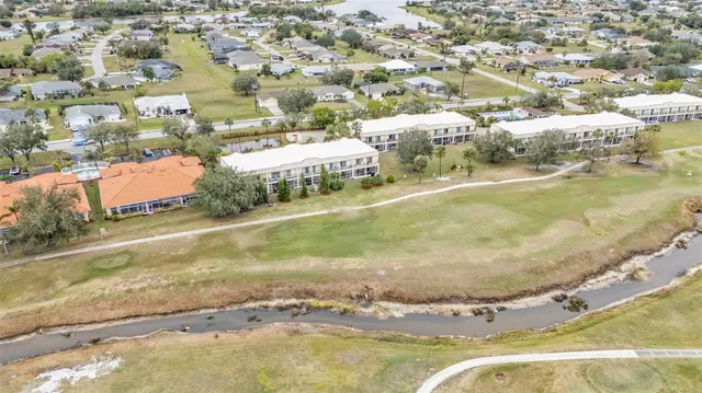 an aerial view of residential houses with city view