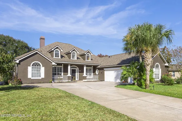 front view of a house with a garden