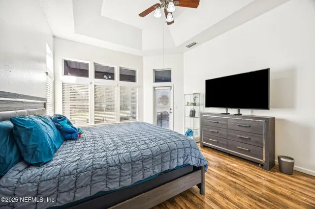 a bathroom with bathtub and window