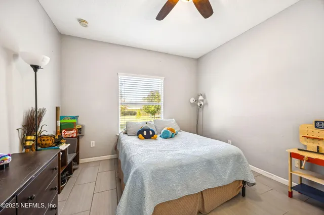 a bathroom with a sink vanity mirror and toilet