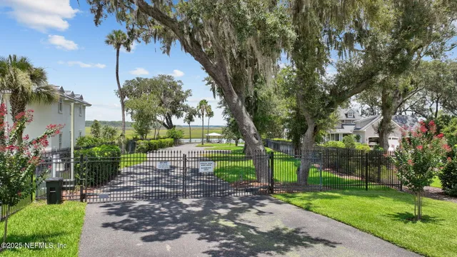 a swimming pool view with a seating space and a garden