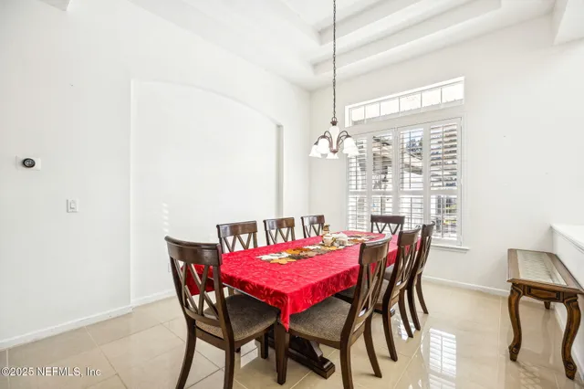 a kitchen with stainless steel appliances granite countertop a refrigerator a stove a sink and a refrigerator