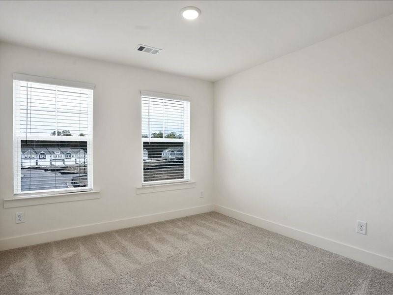2539 Riverside Court Northeast Conyers, GA 30013 - Photo 17 of 31 an empty room with a window