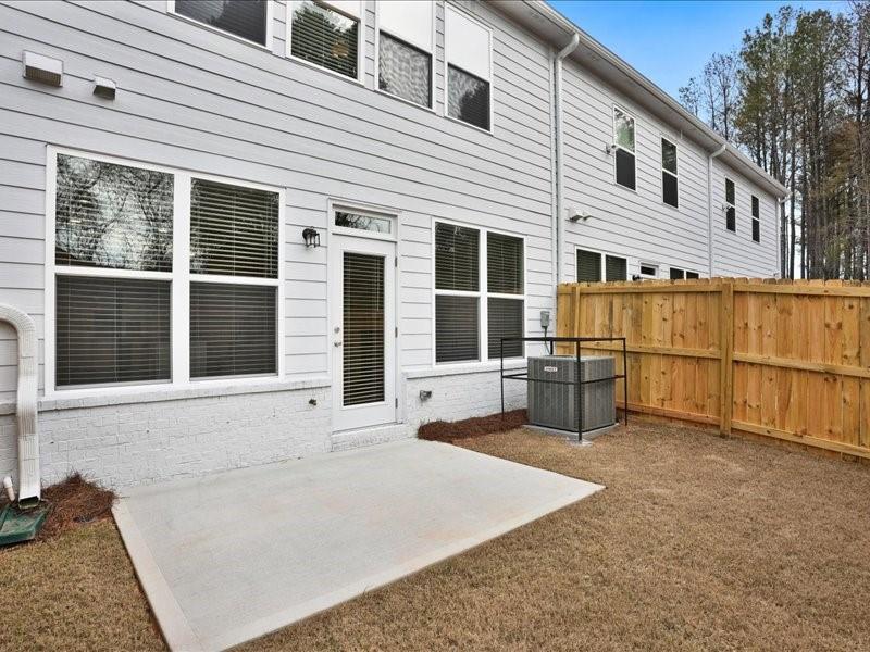 2539 Riverside Court Northeast Conyers, GA 30013 - Photo 20 of 31 a view of a house with large windows