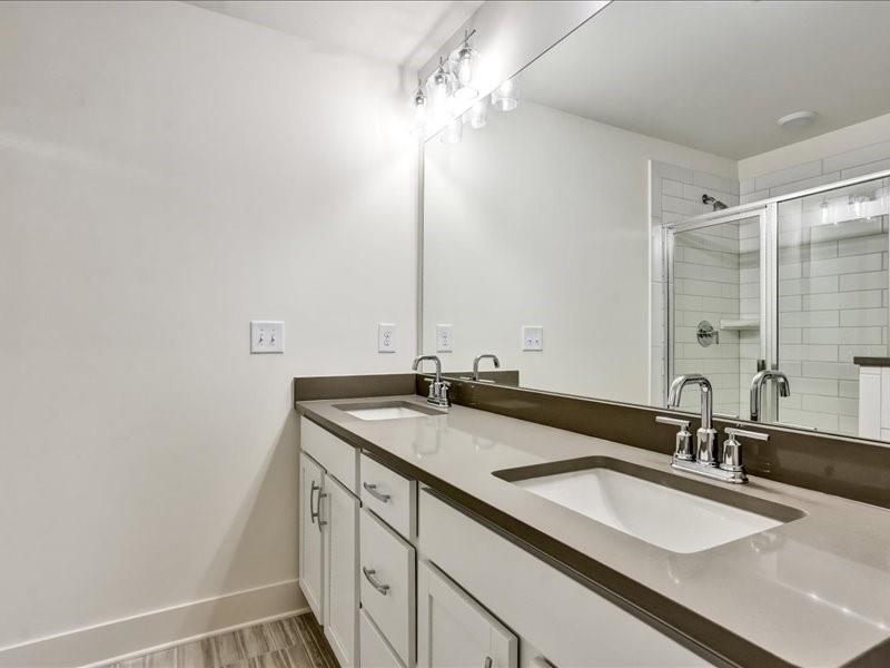 2539 Riverside Court Northeast Conyers, GA 30013 - Photo 21 of 31 a bathroom with a sink and a mirror