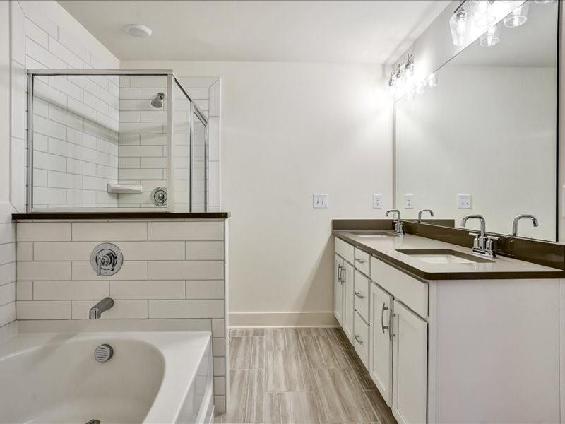 2539 Riverside Court Northeast Conyers, GA 30013 - Photo 24 of 31 a bathroom with a sink and a bathtub