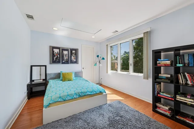 a bedroom with furniture and a rug