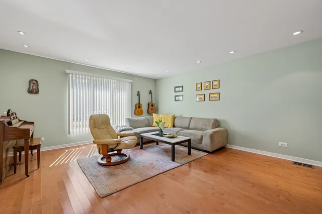 a living room with furniture rug and a window