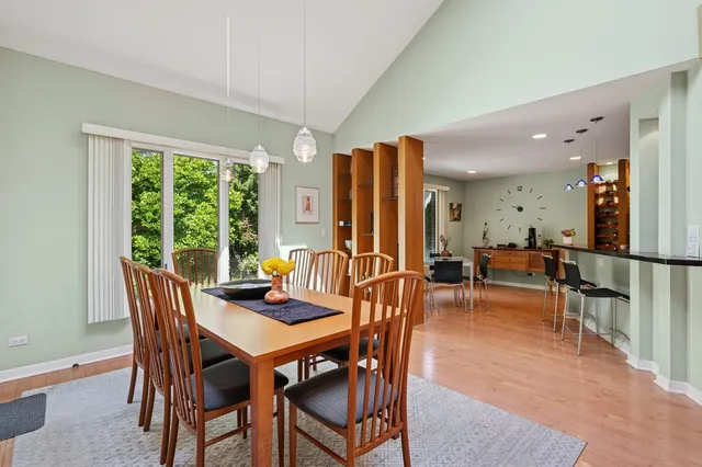 a view of a dining room with furniture window and outside view