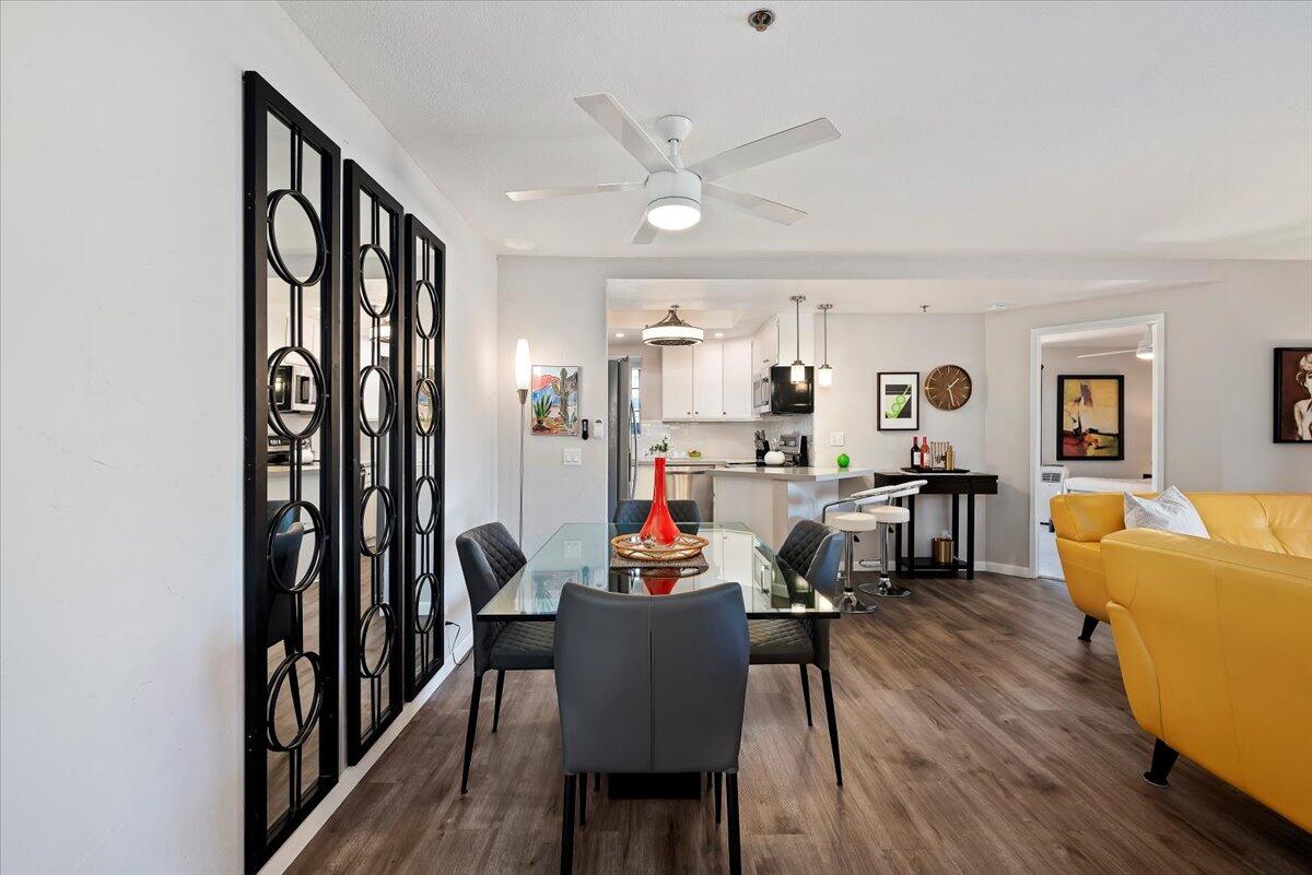 2700 Lawrence Crossley Road, Unit 10 Palm Springs, CA 92264 - Photo 2 of 15 a living room with furniture and a wooden floor